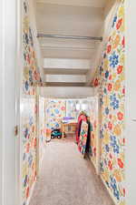 Bedroom featuring light colored carpet