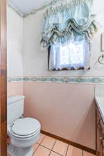 Bathroom with vanity and light tile patterned floors