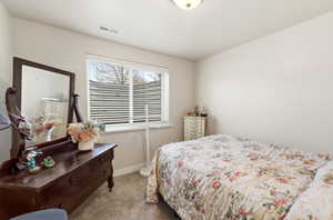 Carpeted bedroom with baseboards