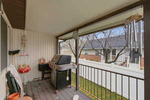 Wooden deck featuring grilling area