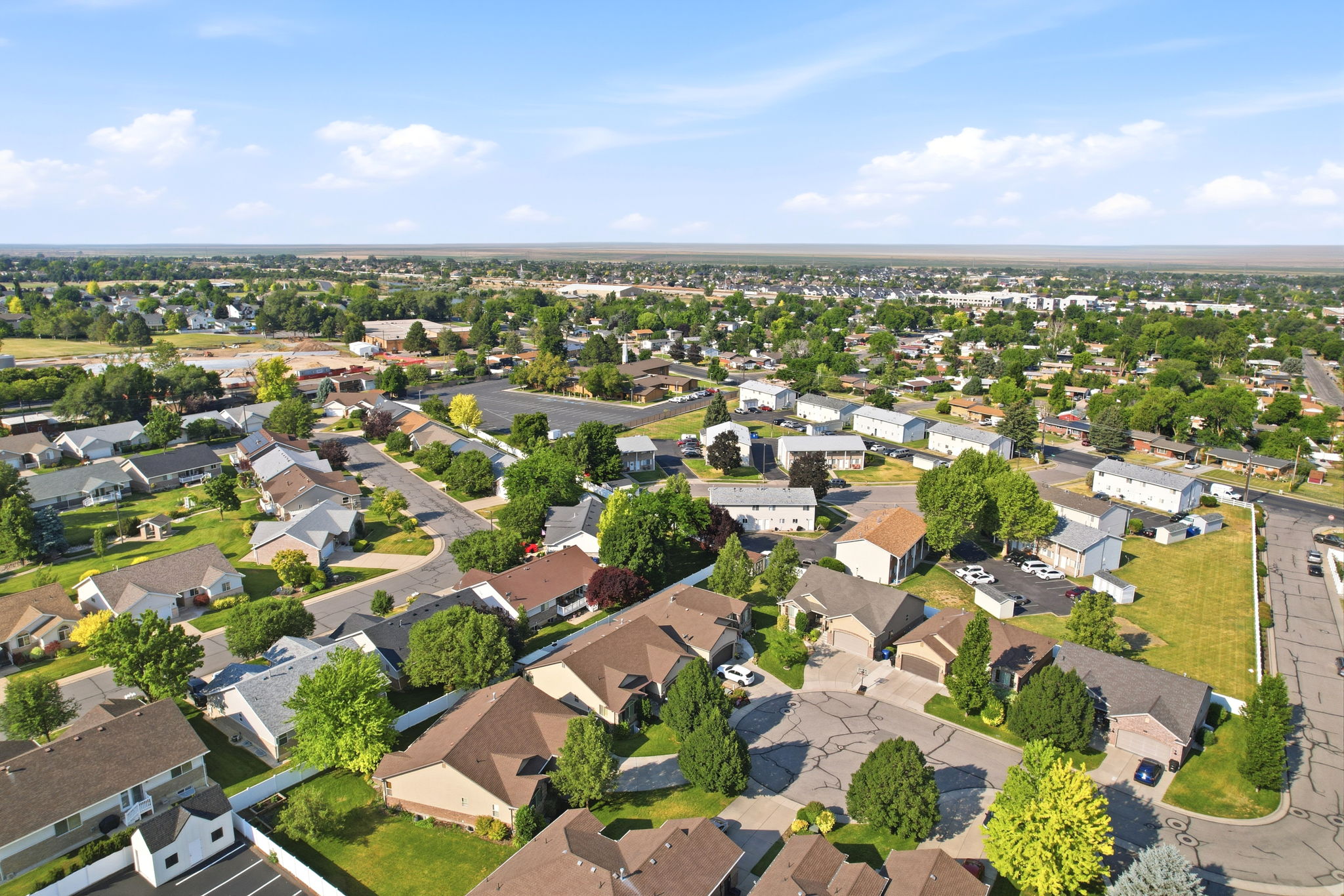 Aerial perspective showcasing a residential neighborhood with varied single-story and multi-story homes