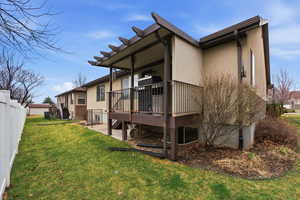 Back of property featuring a deck