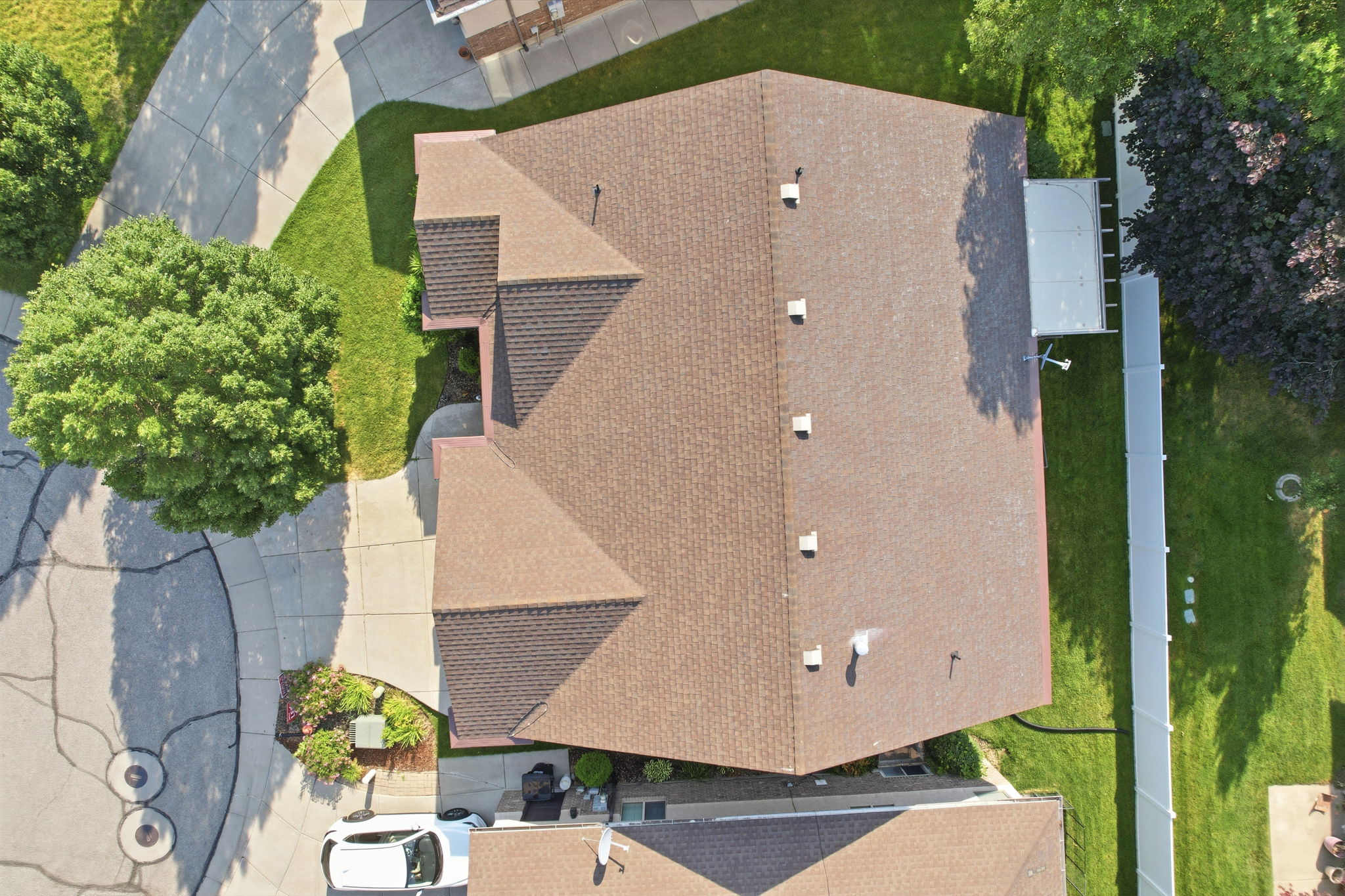 Architectural shingle roof featuring multiple gables and vents