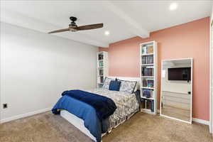 Carpeted bedroom featuring beam ceiling, ceiling fan, and recessed lighting