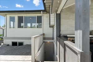 View of property exterior with a garage and driveway