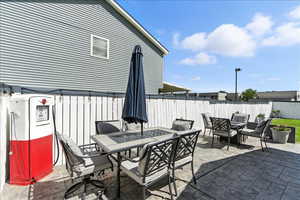 Fenced backyard featuring outdoor dining area and a patio area