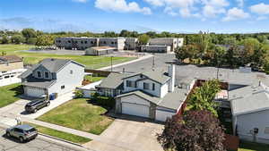 Aerial perspective of suburban area featuring a mountainous background