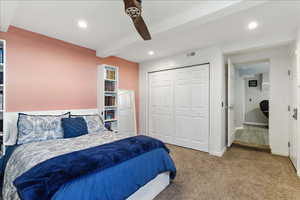 Bedroom with carpet floors, beamed ceiling, recessed lighting, ceiling fan, and a closet