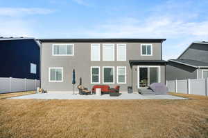 Back of house with a patio and stucco siding