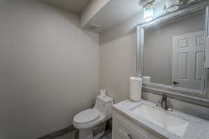 Half bath with toilet and vanity