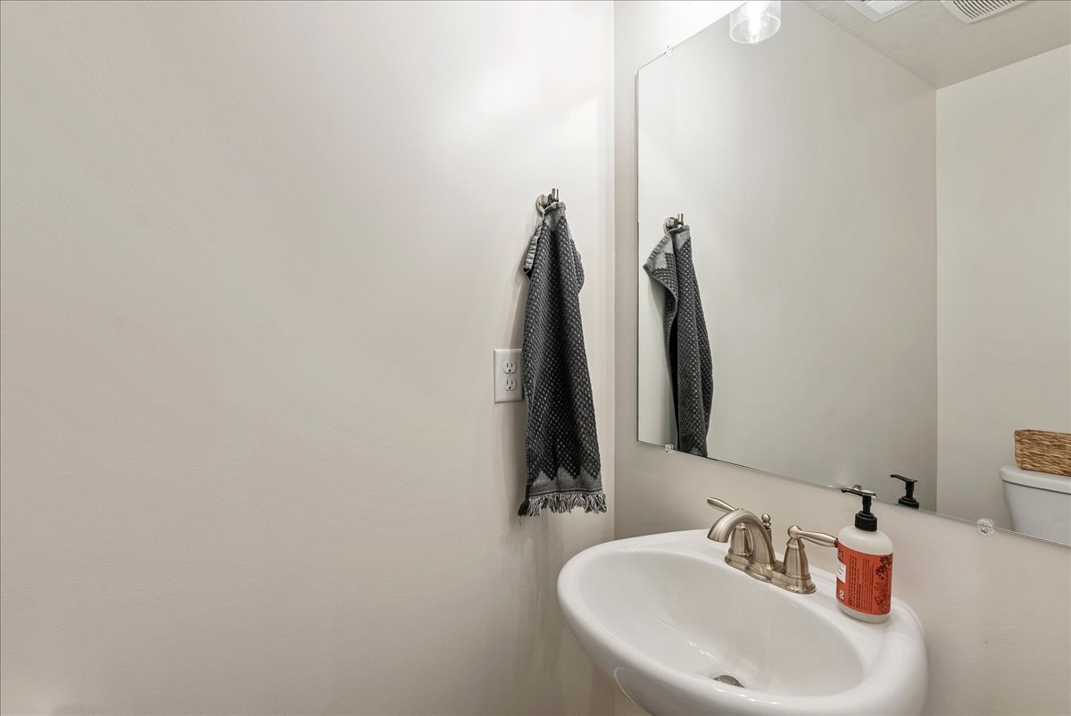 Half bathroom featuring a sink