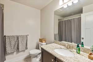 Bathroom featuring vanity and a shower with curtain