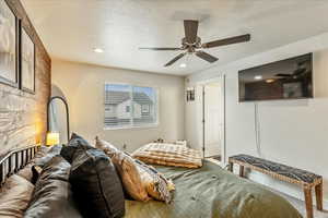 Bedroom featuring recessed lighting, a textured ceiling, and a ceiling fan