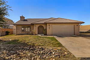 Mediterranean / spanish-style house featuring a chimney, concrete driveway, an attached garage, stucco siding, and a tile roof