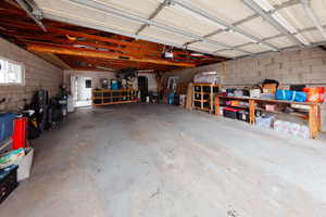 Garage featuring concrete block wall