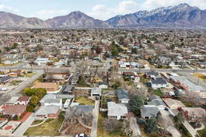 Aerial perspective of suburban area with a mountainous background