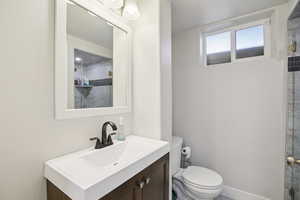 Full bath with vanity and toilet