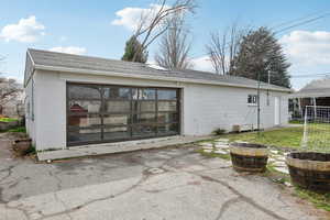 Side view of the garage door paneling into the office/gym, allowing tons of natural light