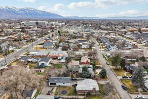 Aerial view of residential area featuring a mountain backdrop