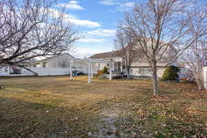 View of yard with a pergola and a patio area
