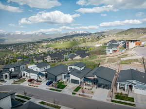 Aerial perspective of suburban area with a mountainous background