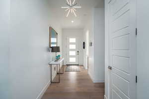 Entryway featuring wood-type flooring and recessed lighting