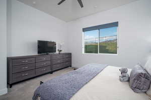 Bedroom featuring light colored carpet and ceiling fan