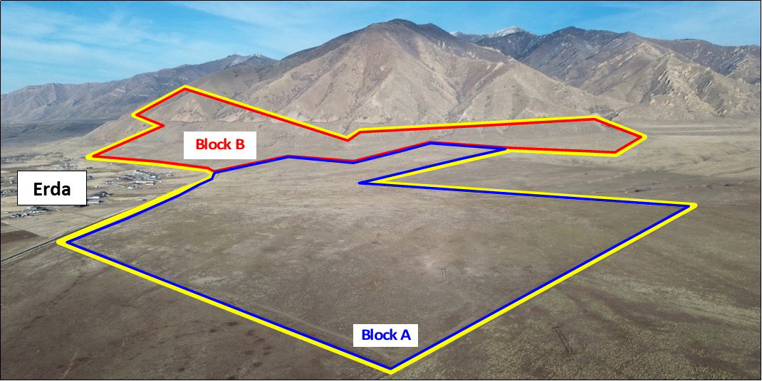 Aerial view of property's location featuring property parcel outlined and a mountainous background