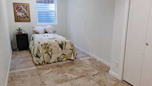 Bedroom featuring baseboards