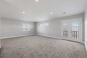 ADU second floor living space with two-tone paint, recessed lighting, and carpet flooring