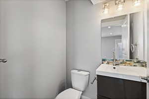 ADU main floor bathroom with vanity and toilet
