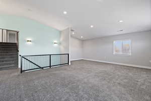 ADU second floor living space with two-tone paint, recessed lighting, and carpet flooring