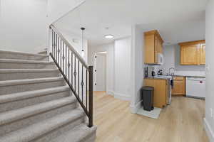 Basement stairwell and second kitchen space