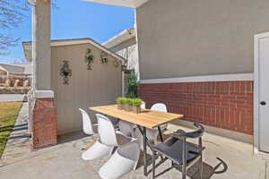 Spacious covered patio area with outdoor lighting