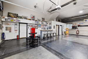 Custom-built shop, heated and fully finished featuring car lift, bar, and bathroom