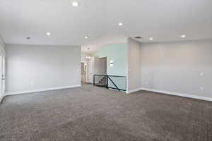 ADU second floor living space with two-tone paint, recessed lighting, and carpet flooring