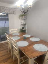 Dining room with a chandelier and wood finished floors
