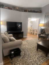 Living area with wood finished floors and baseboards