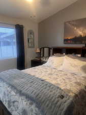 Bedroom with vaulted ceiling