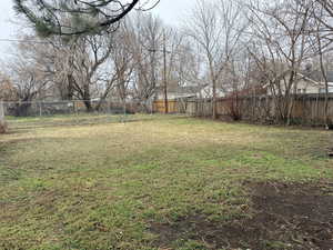 View of fenced backyard