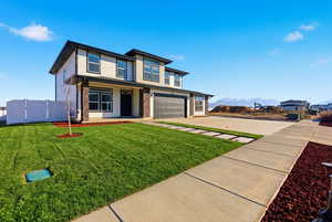 Grass Virtually Added - View of front of property featuring a garage, covered porch, driveway, and a mountain view
