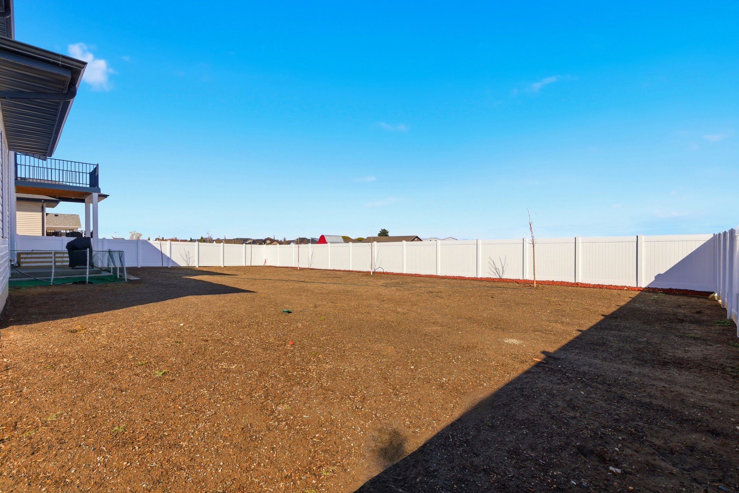 View of fenced backyard