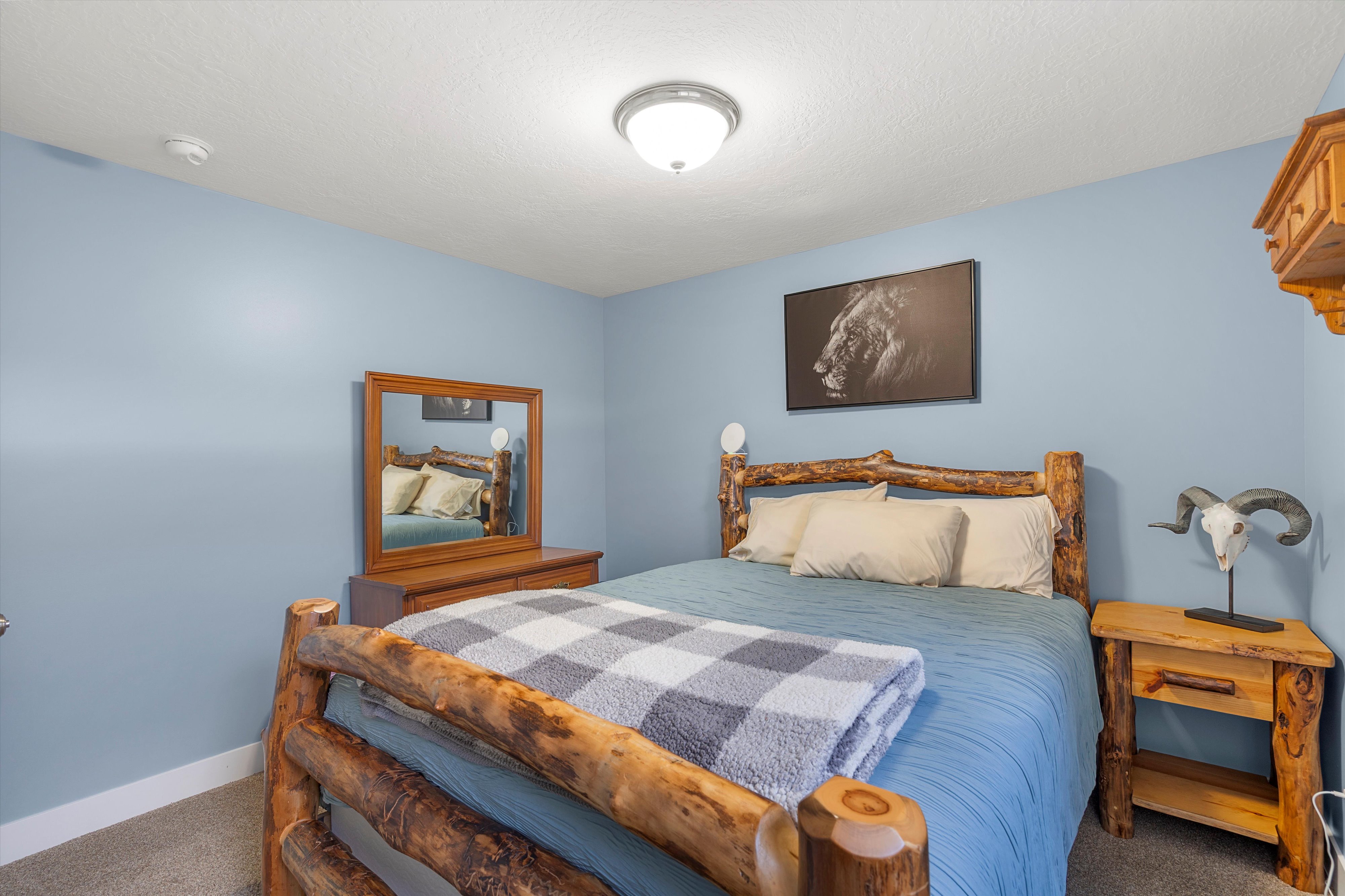 Carpeted bedroom featuring a textured ceiling