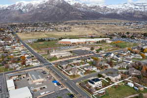 View of property location featuring mountains, property boundaries highlighted, and nearby suburban area