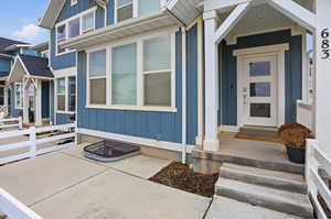 View of exterior entry with board and batten siding