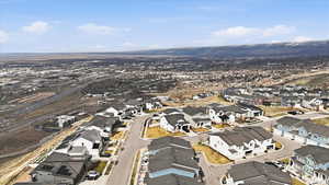 Aerial view of property's location featuring nearby suburban area
