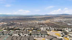 Aerial perspective of suburban area with a mountain backdrop
