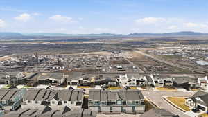 Aerial perspective of suburban area with a mountainous background