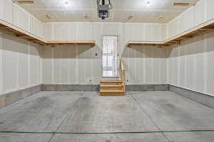 Garage featuring a garage door opener