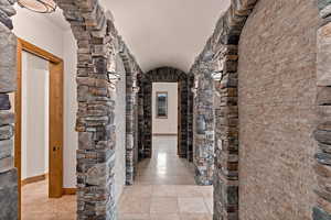 Hallway off entry with full bathroom on left and bedrooms
